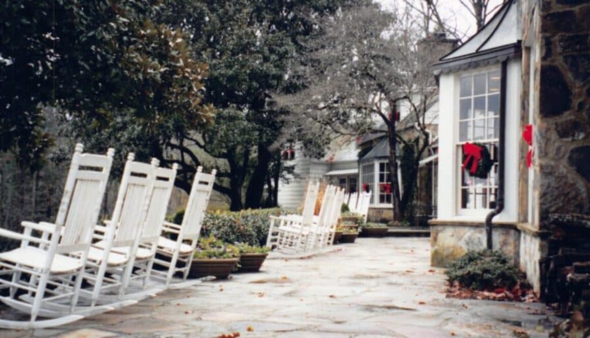 Blackberry Farm Tennessee -rocking chairs on a stone path outside the resort grounds.