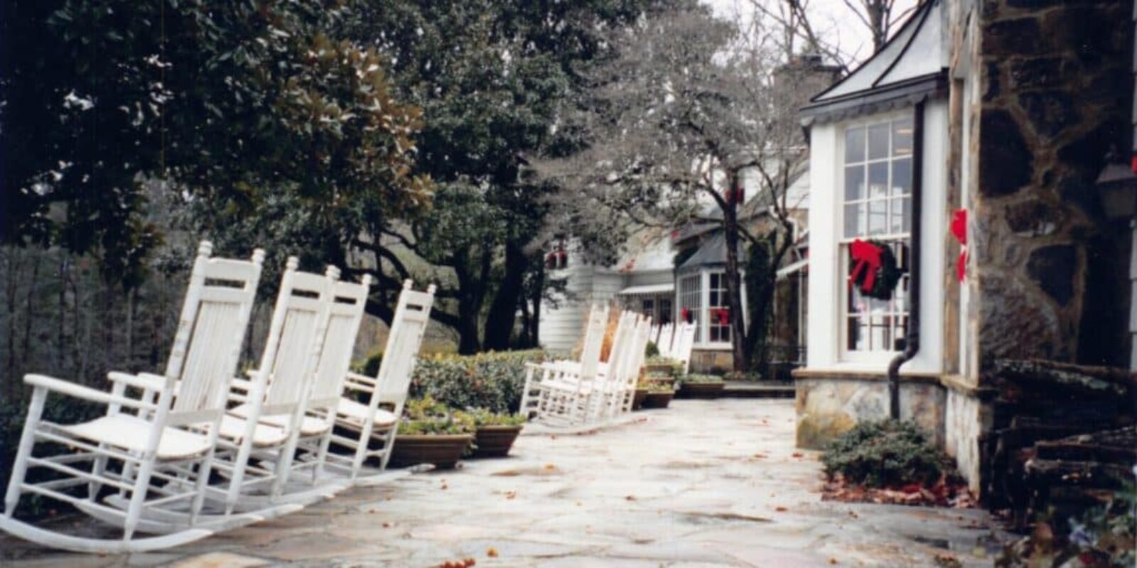 Blackberry Farm Tennessee -rocking chairs on a stone path outside the resort grounds.