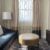 sitting room with couch, coffee table and television in a hotel room