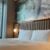king bed beside a window in a hotel room