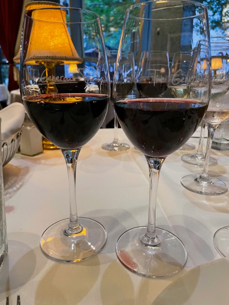 glasses of red wine on a table