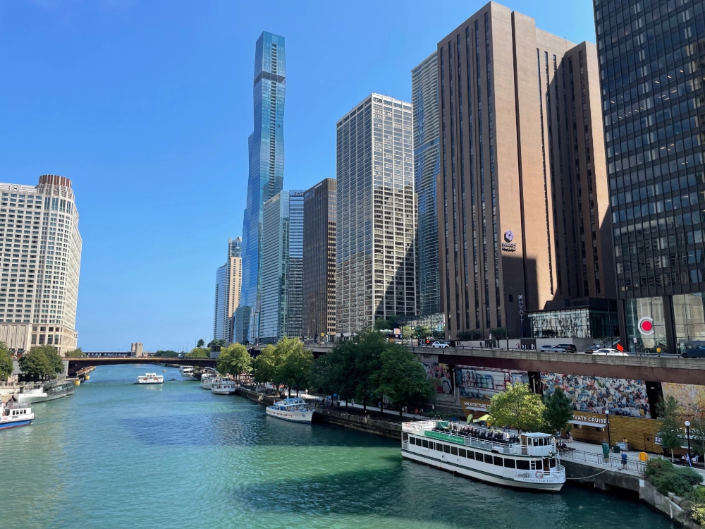 tour boats on the banks of the Chicago River in downtown Chicago