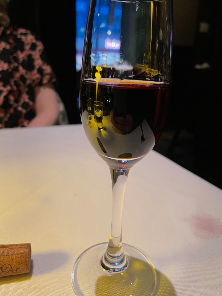 a glass of tawny port on a table