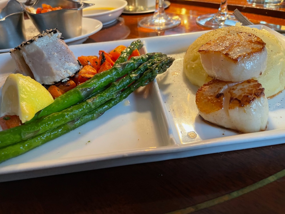 albacore tuna, scallops, vegetables, a lemon wedge and pureed potatoes