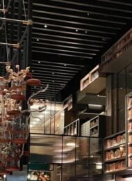 contemporary restaurant with a decorative wall of books