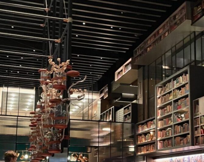 contemporary restaurant with a decorative wall of books