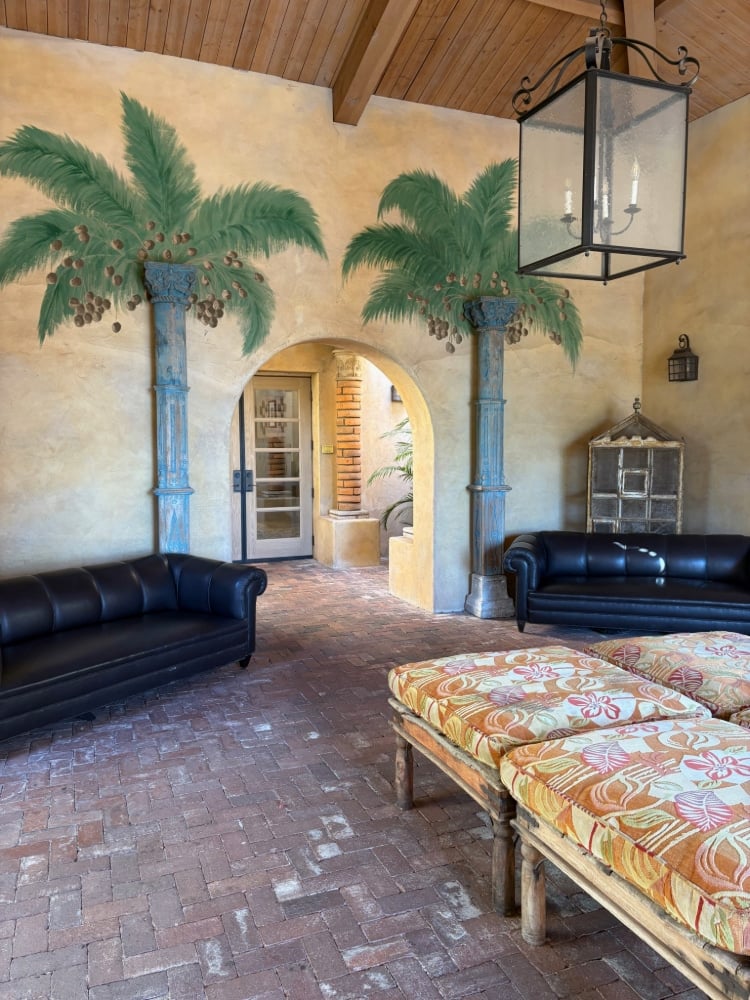 arched doorway framed by palm tree art