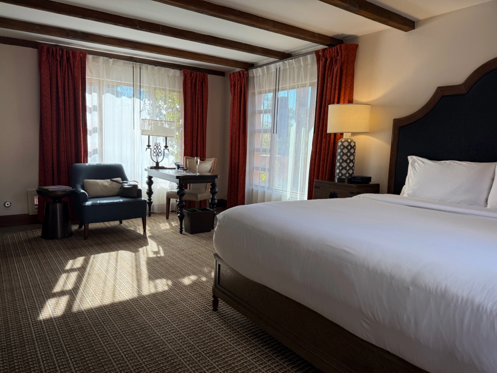 king bed in a spacious hotel room