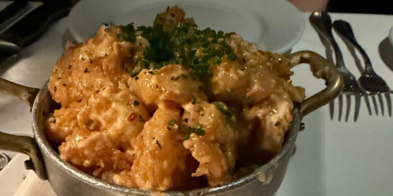 breaded shrimp appetizer served in a metal pot