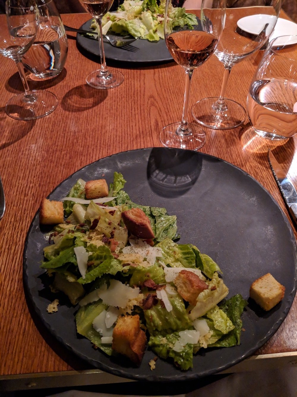 Caesar Salad on a slate plate to start